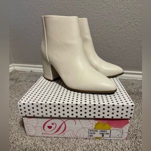 White faux snakeskin booties